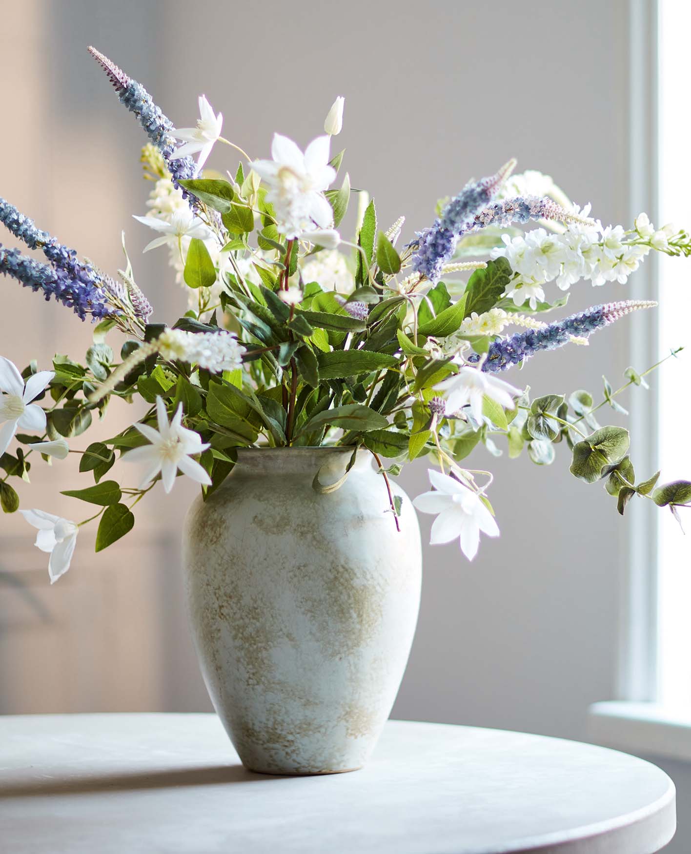 artificial flowers in large vase