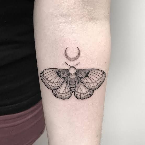 moth tattoo arm