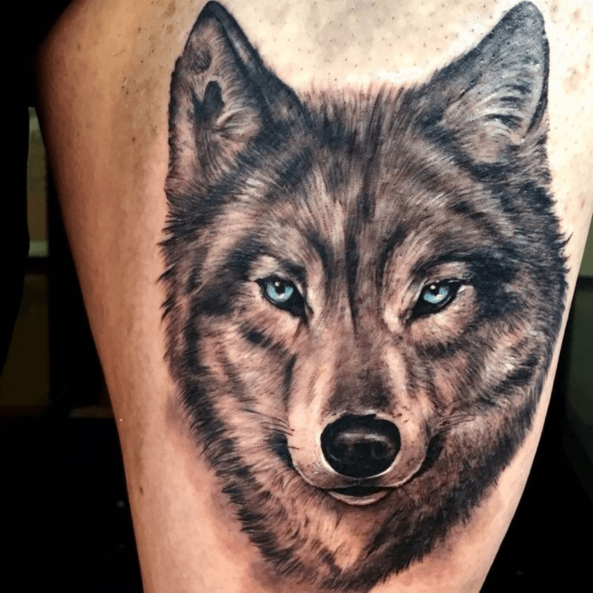 wolf tattoo blue eyes