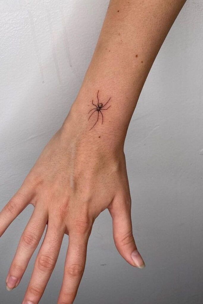 spider tattoo on hand