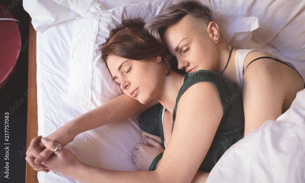 lesbian couple in bed