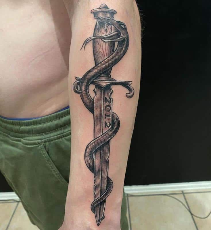 snake with dagger tattoo meaning