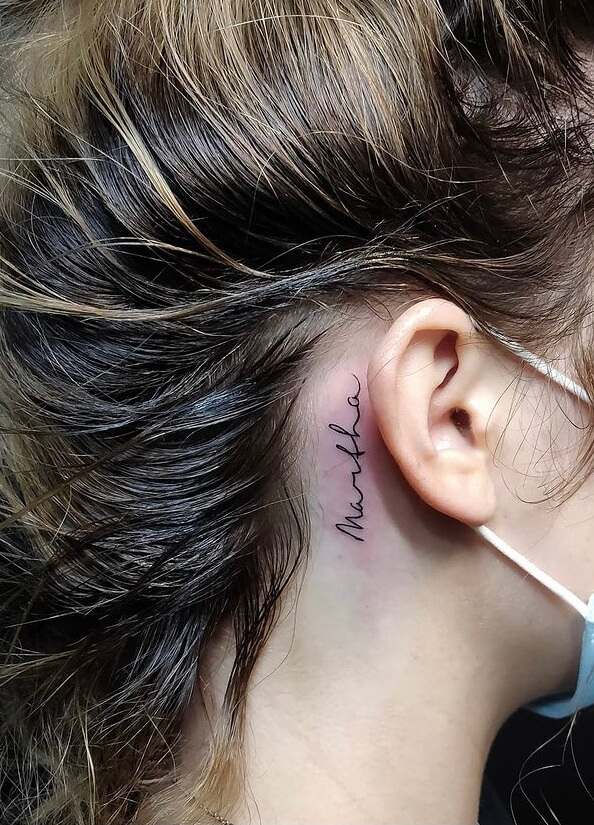 back of earlobe tattoo