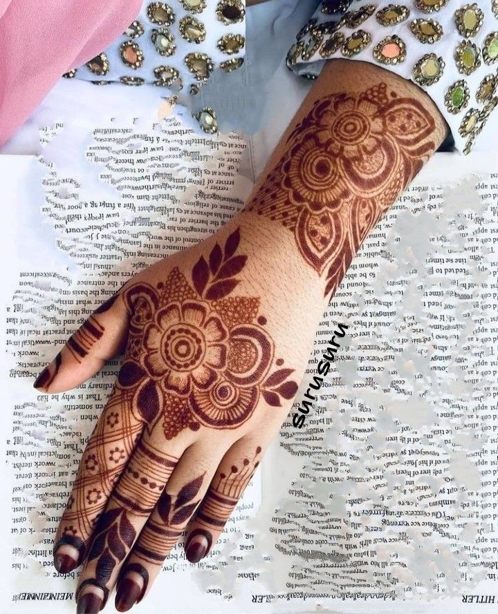 mehndi design behind hand