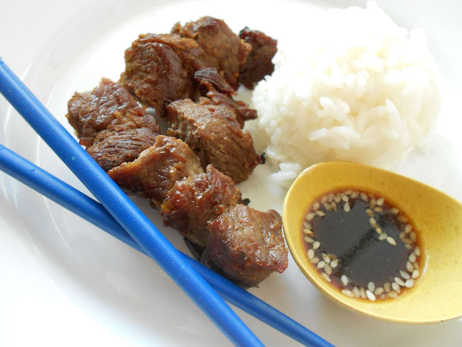 japanese dish of meat marinated in soy sauce crossword clue