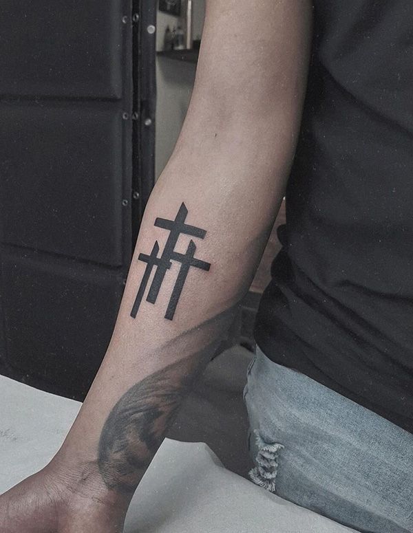 forearm cross tattoo