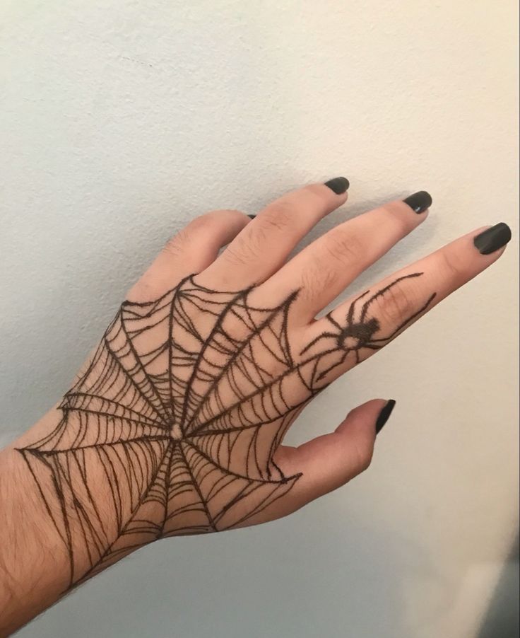 spider web hand tattoo