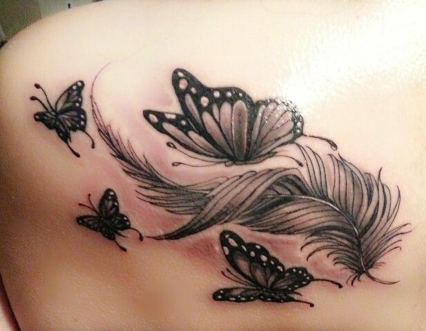 feather tattoo with butterflies