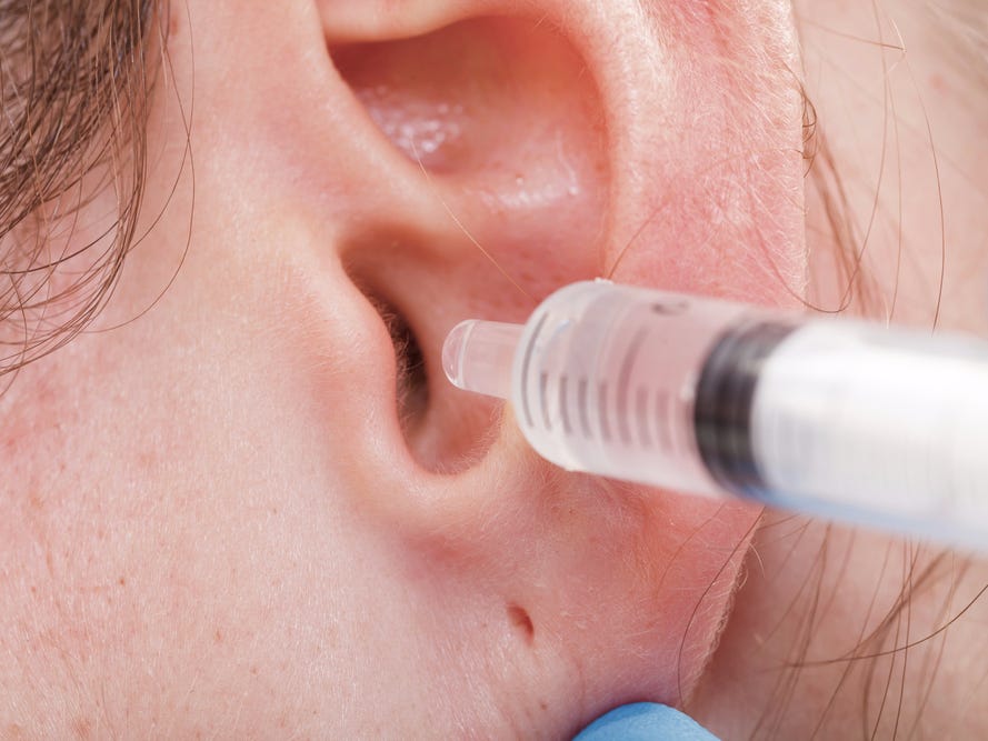 using showerhead to remove ear wax