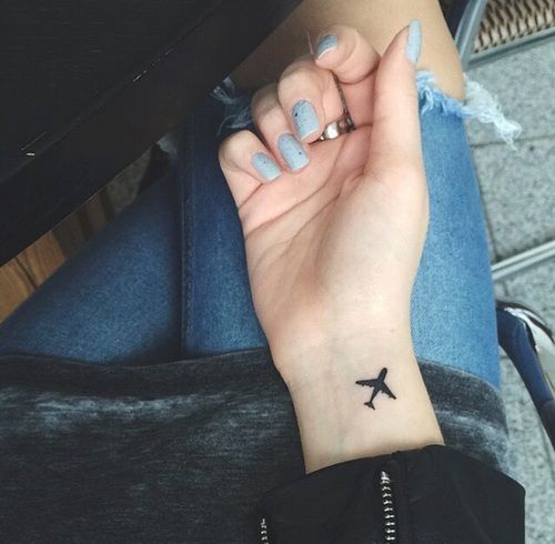 airplane tattoo on hand