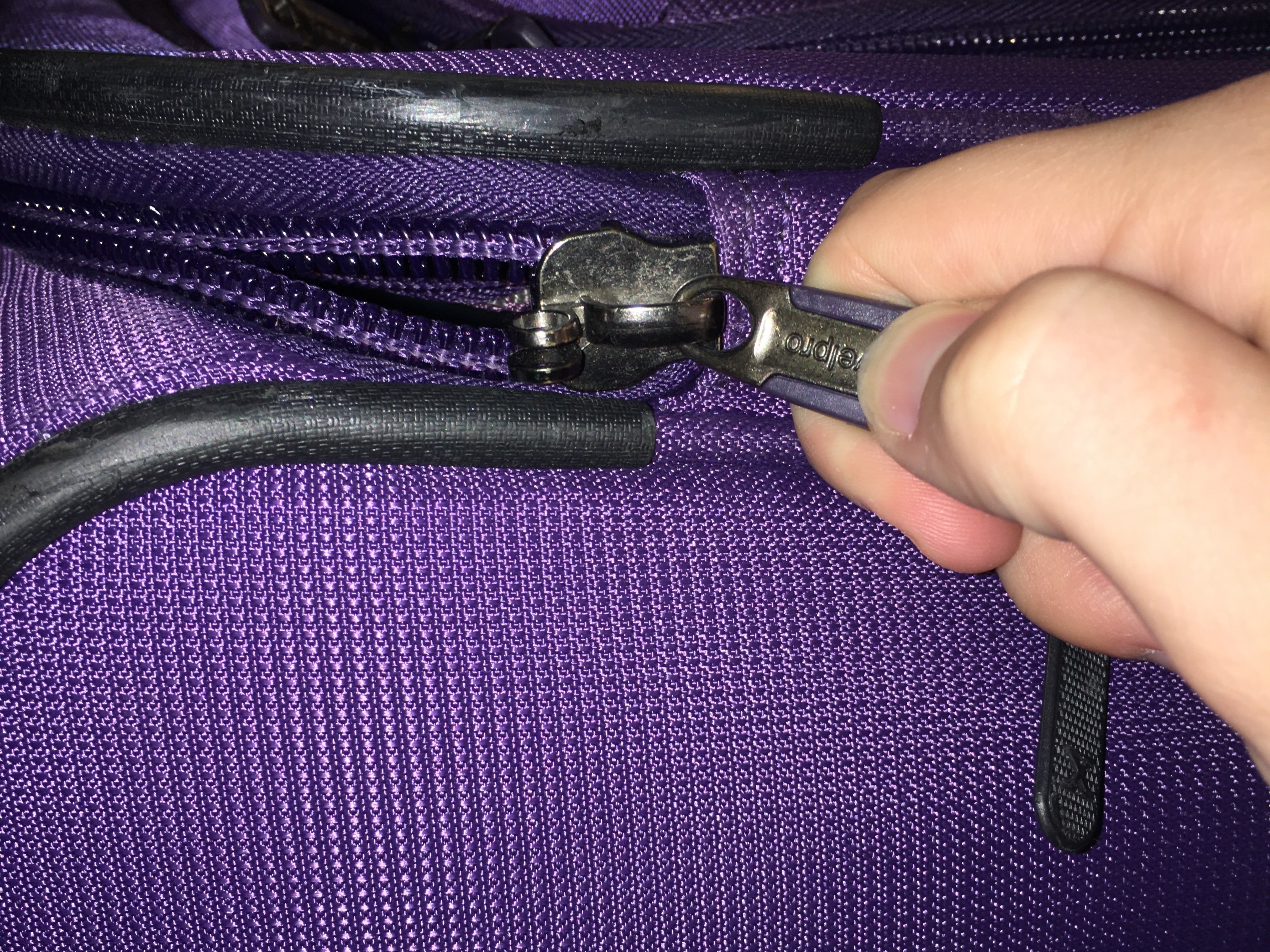 how to fix the zipper on a suitcase