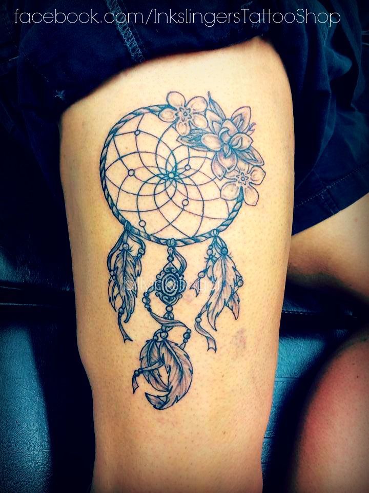 dream catcher tattoo on thigh