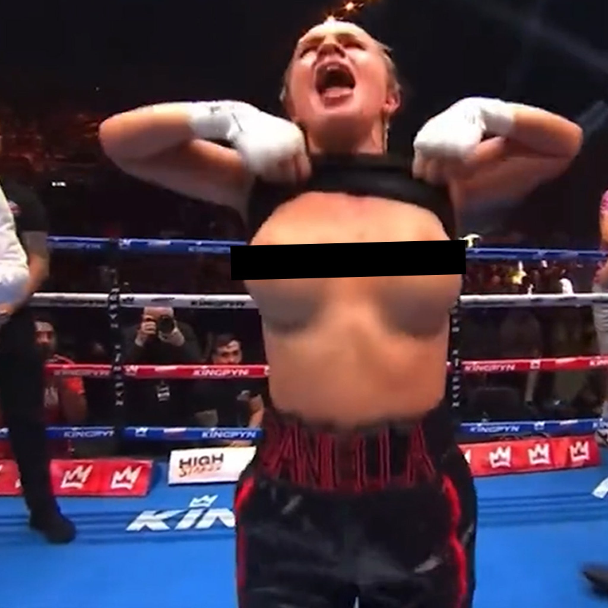 female boxer flashes boobs