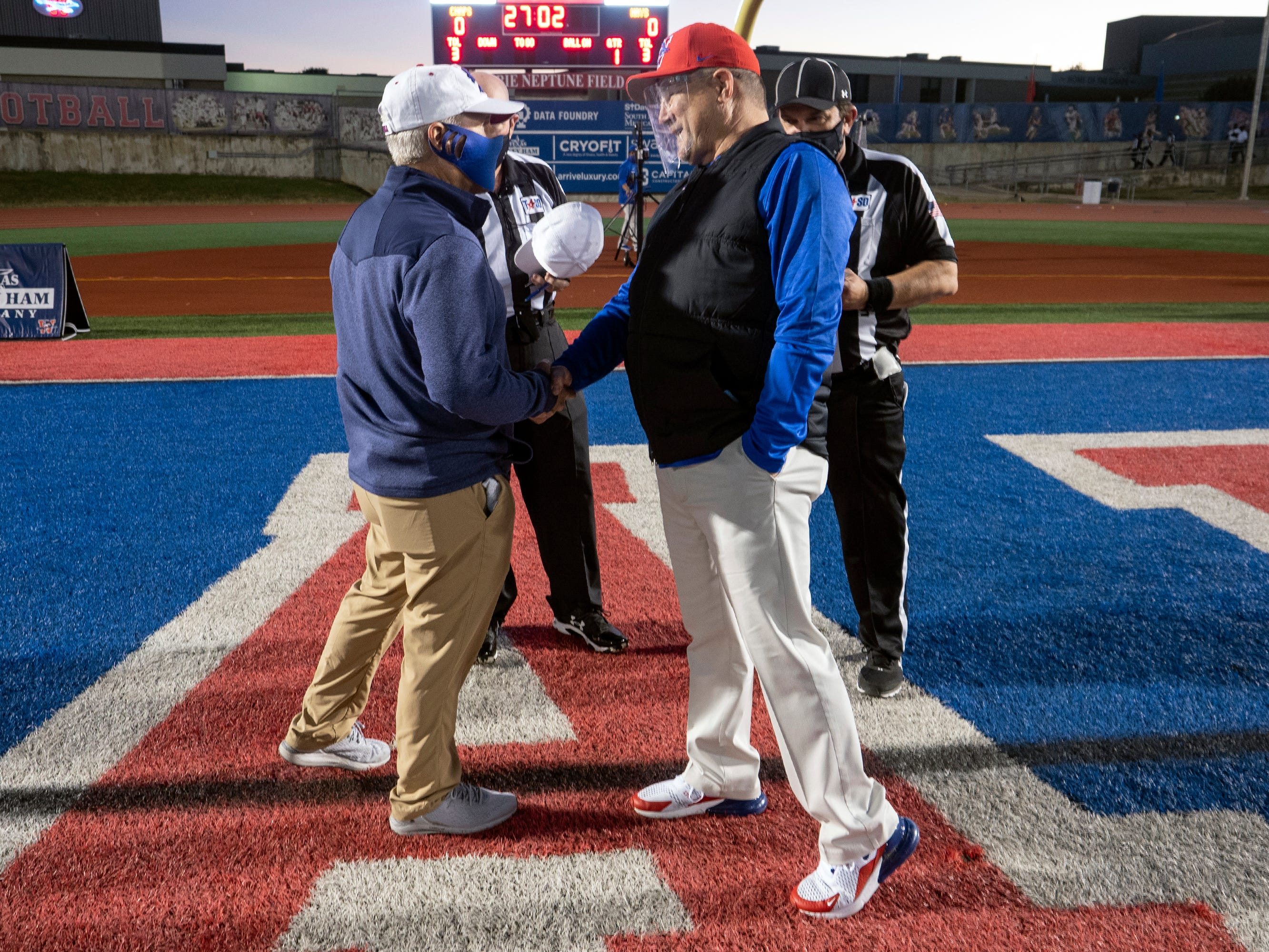 hall of fame football coach hank crossword