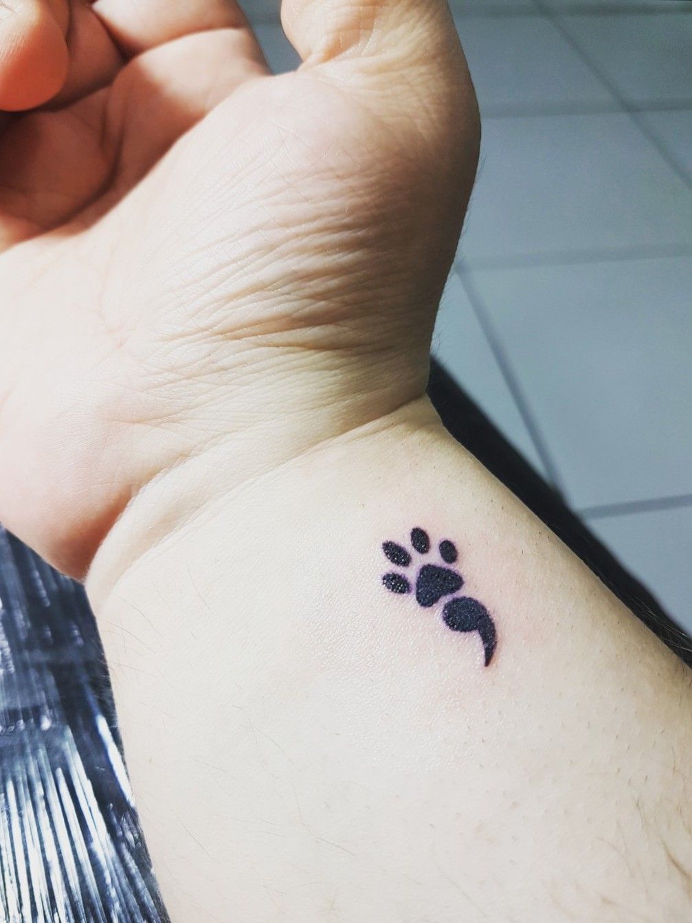 paw print semicolon tattoo