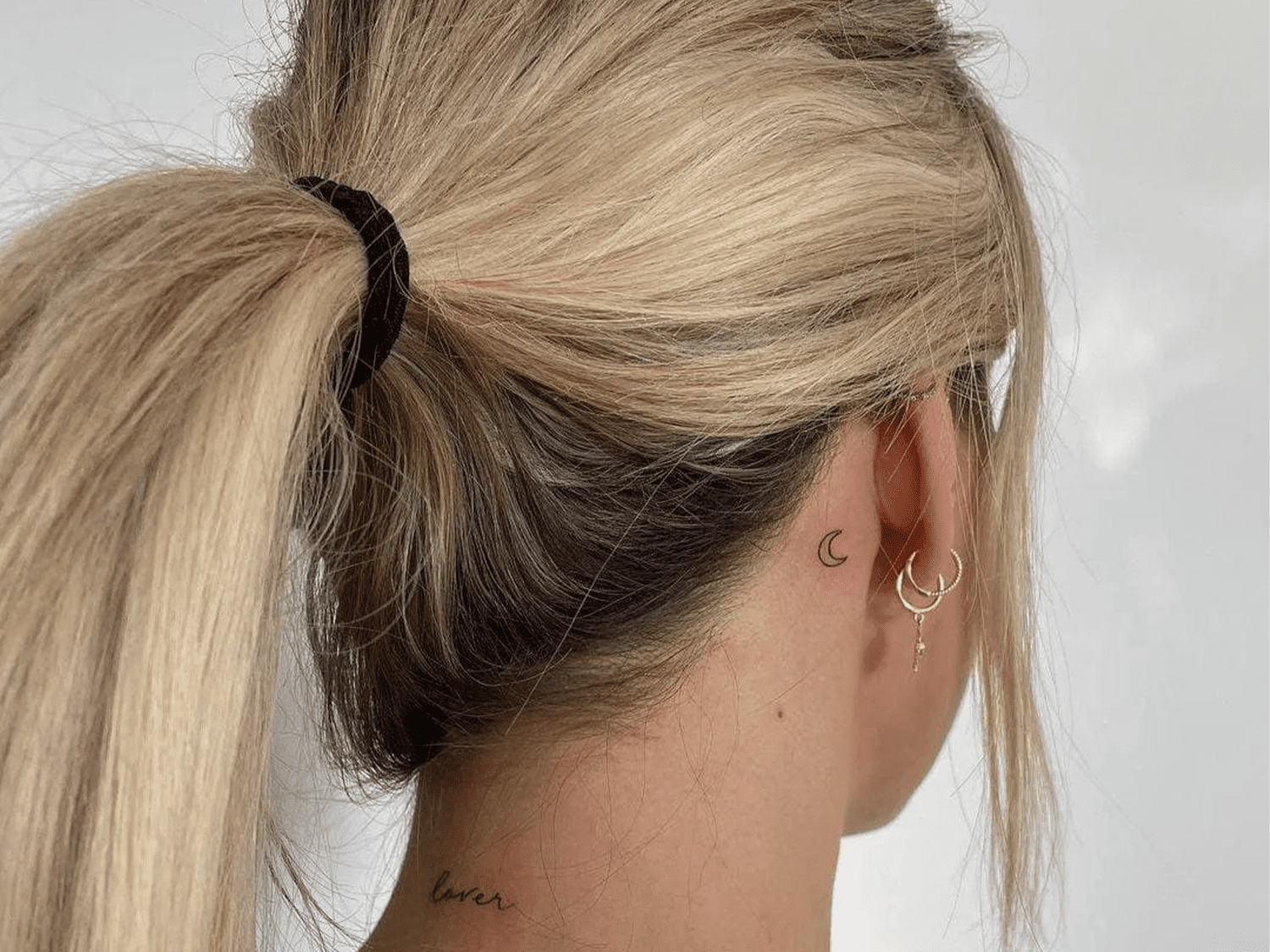 small tattoo behind ear